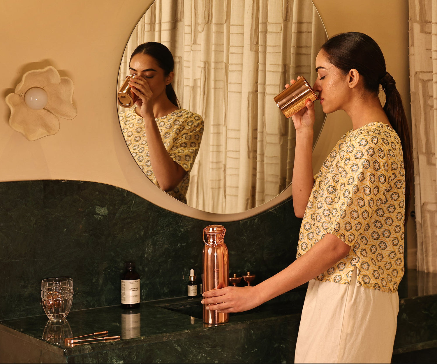 Art of Vedas Ayurveda Copper Bottle Authentic Ayurveda - Woman Drinking from Copper Water Bottle for Digestive Health